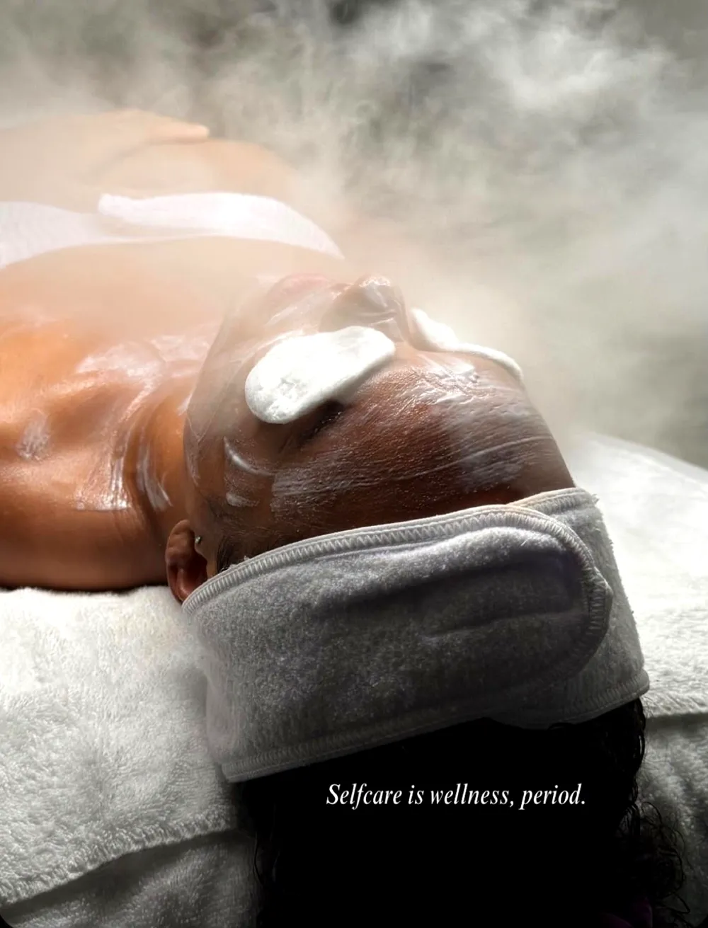 Client enjoying a luxury facial treatment at Lumora